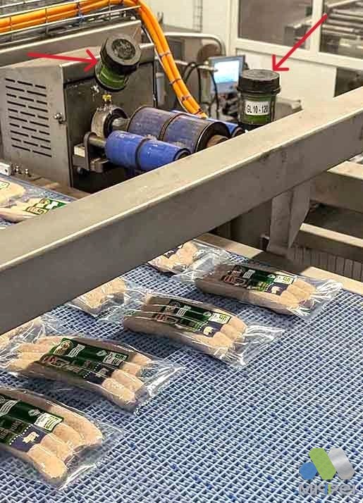Linha de embalagem de alimentos Lubrificadores automáticos nos mancais dos roletes de uma linha de embalagem de alimentos